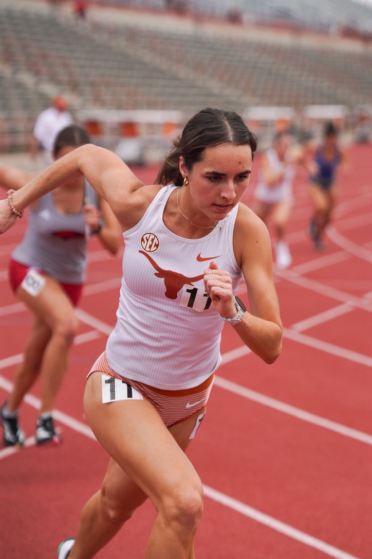 Aishling Callanan racing for Texas in her white Longhorns uniform